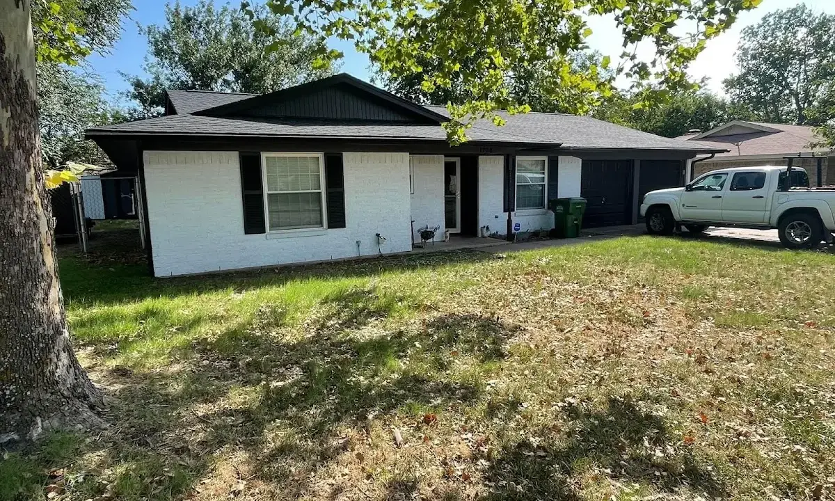 Professional roofing crew working on a residential roof in Northglenn